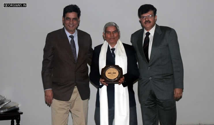 Amarjeet Malik and Vishal Bakshy felicitating K.C. Sharma Sir in Ashoka Auditorium, Manekshaw Centre, New Delhi