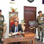 Ajit Doval penning down his memoirs in the School Visitor Book