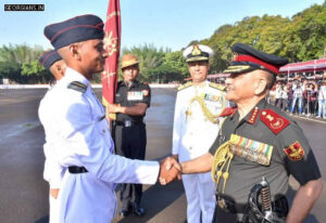 CDS General Anil Chauhan shakes hands with Praveen Singh as NDA Commandant Vice Admiral Ajay Kochhar looks on